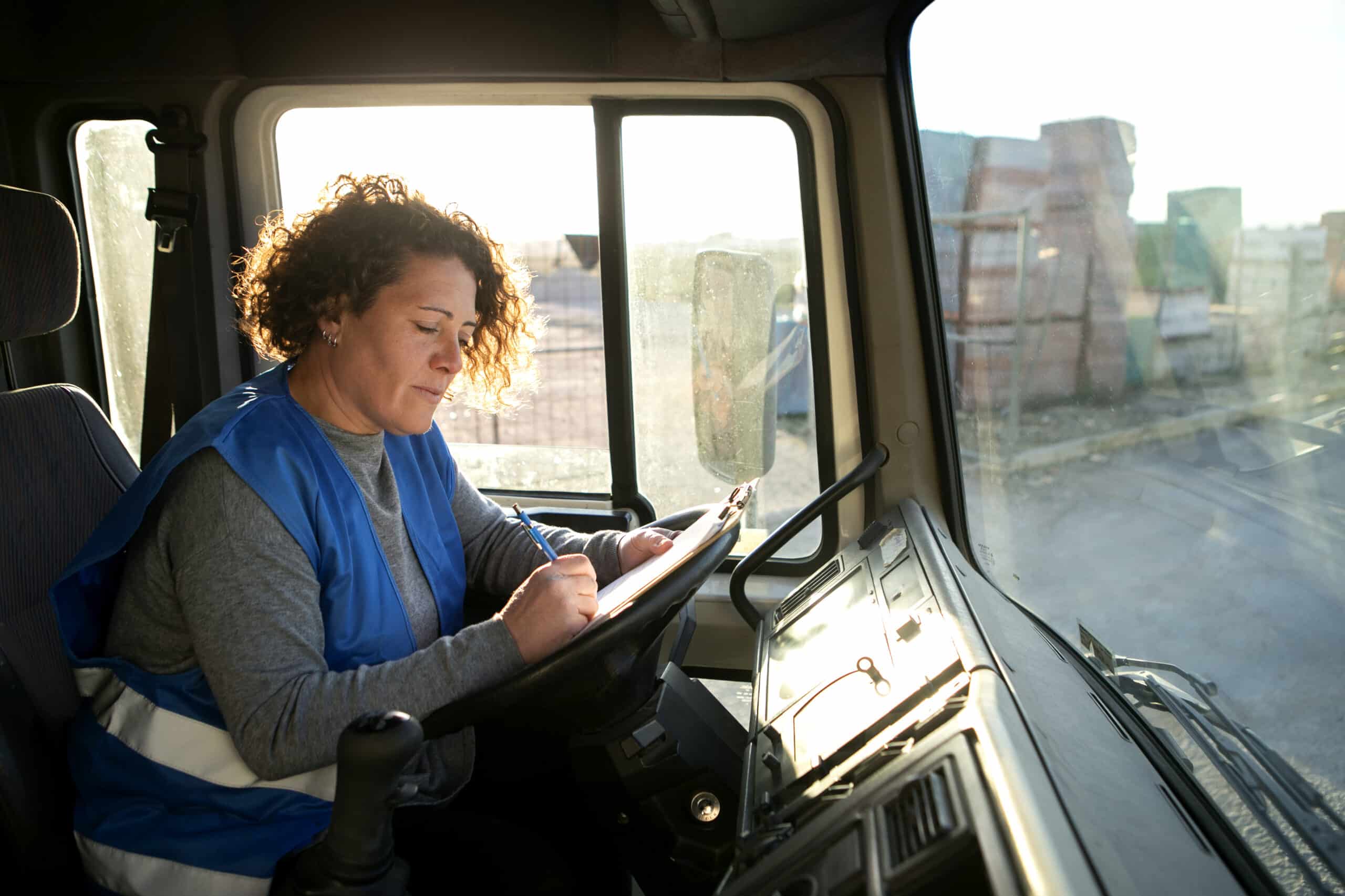 professional female driver with van wagon car scaled