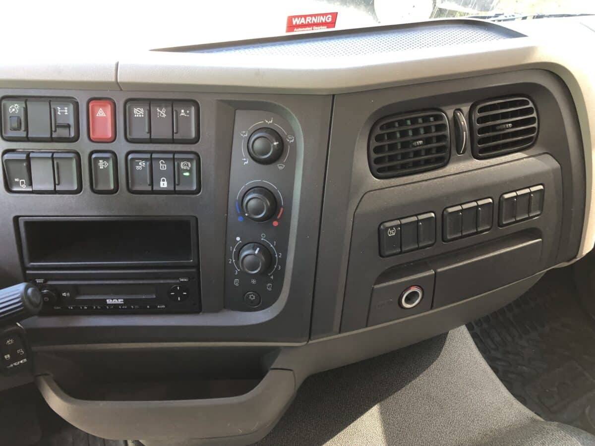 a car dashboard with buttons and switches