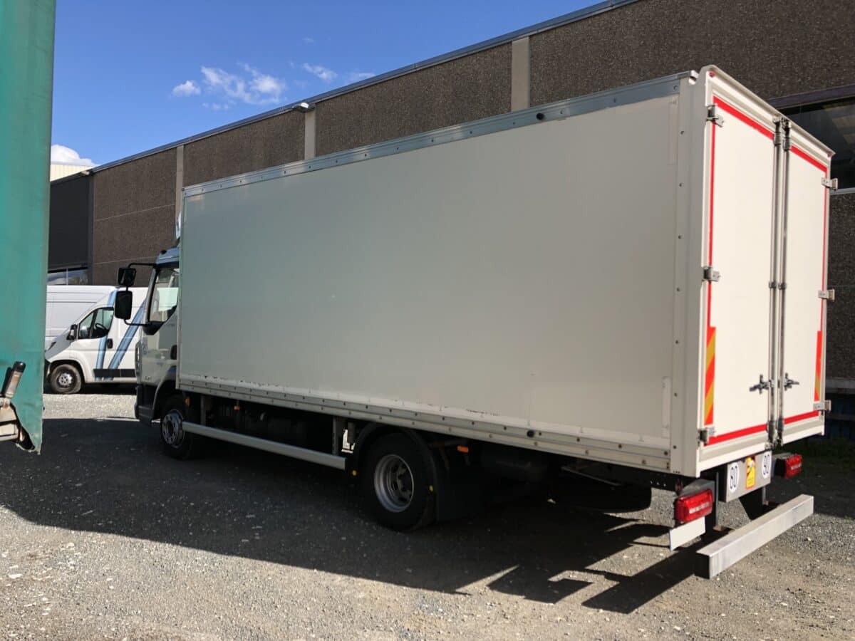 a truck parked in front of a building